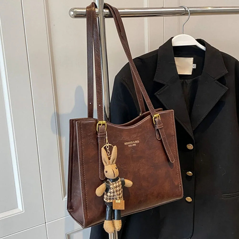 Bolso de hombro Vibes Madrid Emma, schoudertas negra con asas y compartimentos, estilo elegante y funcional.