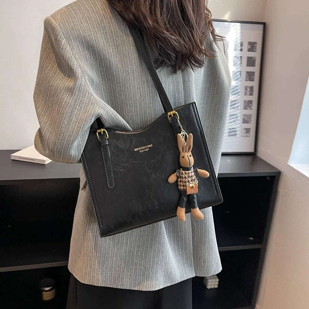 Bolso de hombro Vibes Madrid Emma, schoudertas de diseño compacto y elegante en color neutro, con correa ajustable.